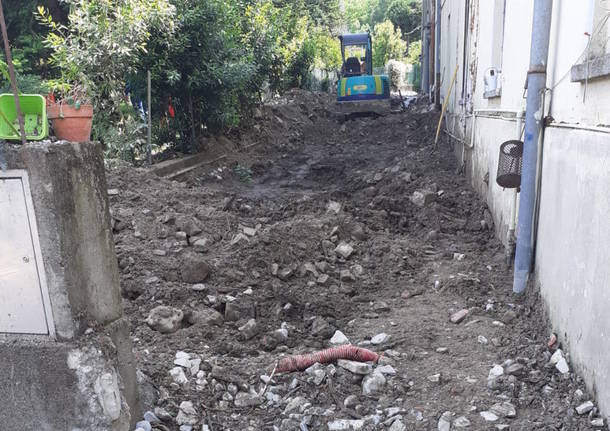 Fango, detriti e sassi trascinati a valle dal Rile