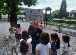 Volontari della Protezione civile di Malnate in missione all'asilo Frascoli di Gurone