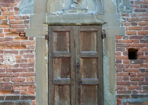 Restaurata un’opera e la porta lignea settentrionale della Collegiata di Castiglione Olona